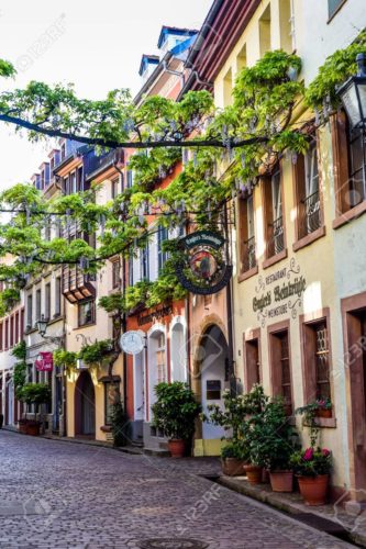 FREIBURG IM BREISGAU, GERMANY - May 17, 2017: old town street in Freiburg, a city in the south-western part of Germany in the Baden-Wurttemberg state.